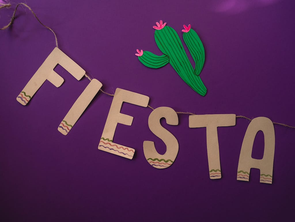 Green Cactus Beside Fiesta on Purple Surface